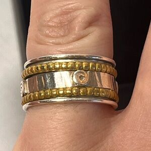 Sterling silver spinner ring. Stamped. Gold accents. Size 7.